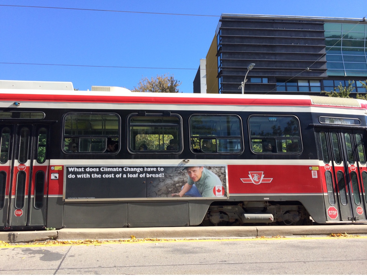 a climate solutions ad on the side of a streetcar
